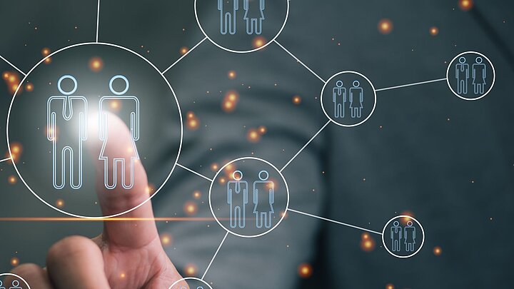 Grafika przedstawiająca palec dotykający ikon wygenerowanych cyfrowo