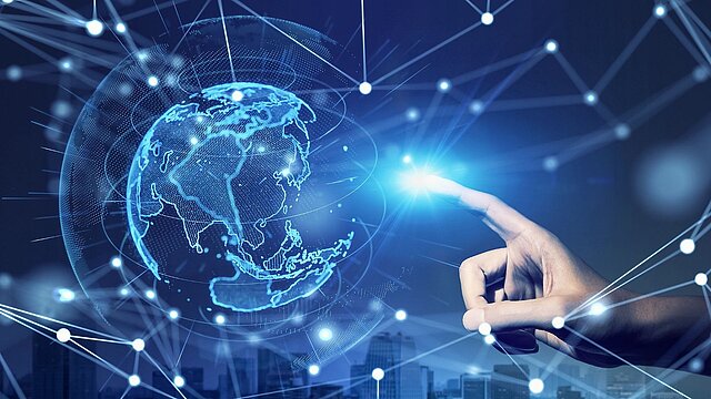 Abstrakcyjna grafika cyfrowej kuli ziemskiej na która wskazuje palec jednej ręki
