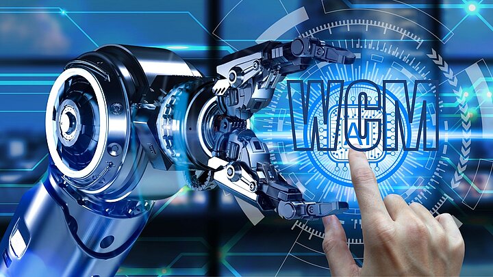 Abstrakcyjna grafika ramienia robota w uścisku trzymającego napis wcm