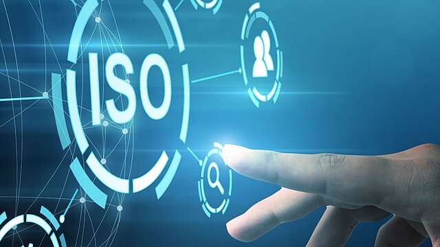 Grafika z kołem w środku którego jest napis ISO